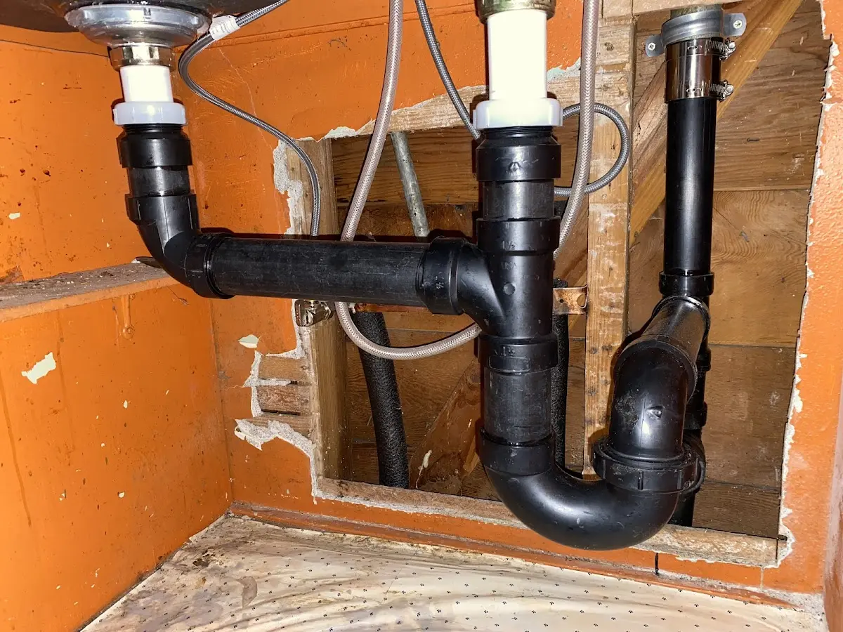 Professional Garbage Disposal Repair equipment and tools on the job in Denton